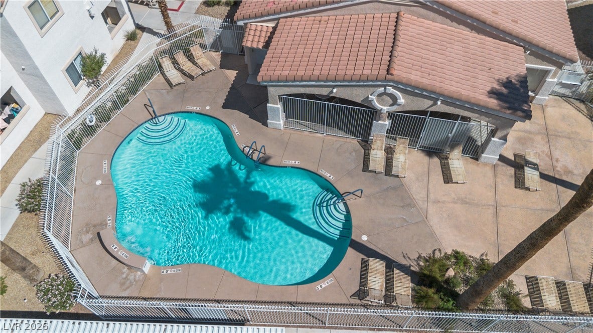 855 N Stephanie Street, #2615, Henderson, NV 89014 A sparkling community swimming pool sits surrounded by a concrete patio and a tile-roofed cabana.