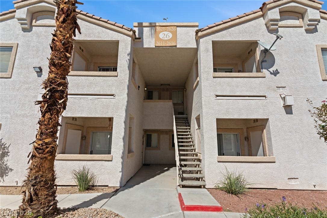 855 N Stephanie Street, #2615, Henderson, NV 89014 Stucco exterior walls paired with a tile roof define this multi-level residential building.