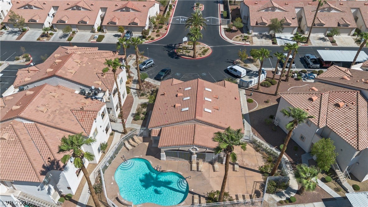 855 N Stephanie Street, #2615, Henderson, NV 89014 A sparkling community swimming pool serves as the focal point among neat desert-landscaped residences.
