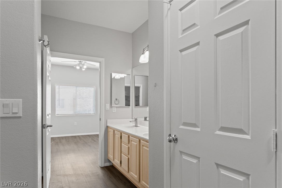 855 N Stephanie Street, #2615, Henderson, NV 89014 Clean lines and dual vanities anchor this spacious master bathroom suite.