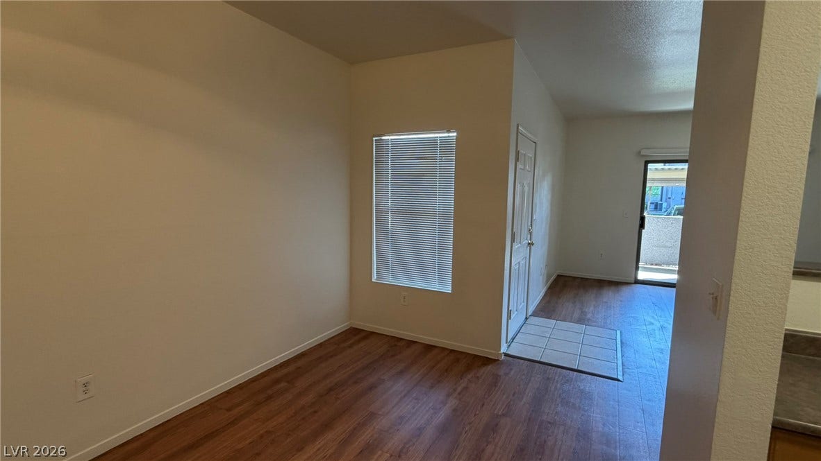 45 Maleena Mesa Street, #1912, Henderson, NV 89074 Rich wood-inspired flooring pairs with tall ceilings to create a welcoming first impression.
