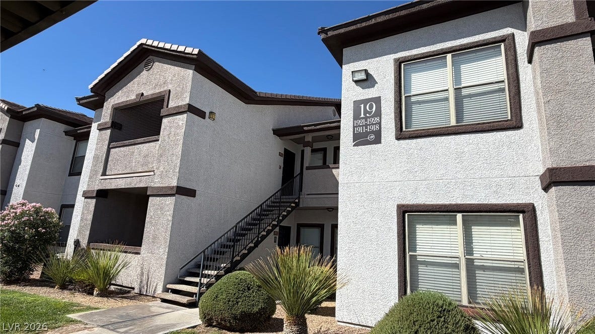 45 Maleena Mesa Street, #1912, Henderson, NV 89074 Multi-level stucco exterior showcases classic architectural details and an open staircase design.