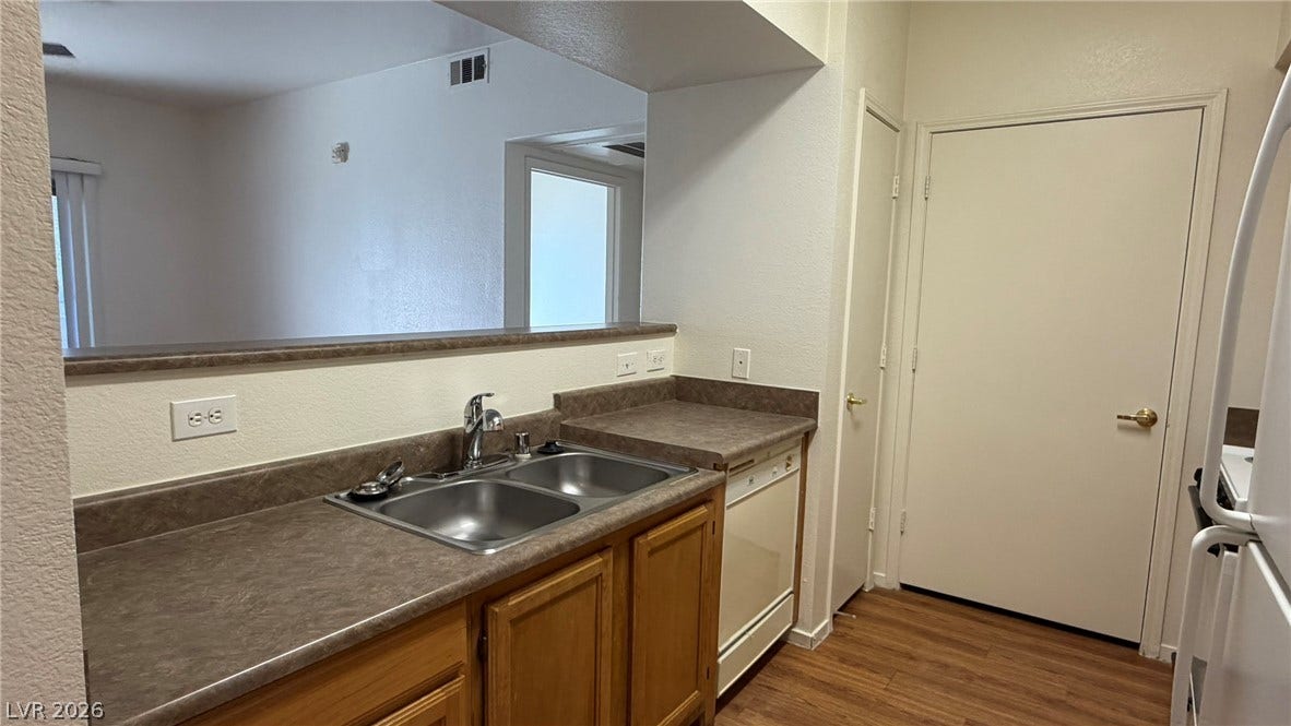 45 Maleena Mesa Street, #1912, Henderson, NV 89074 A breakfast bar opens from the kitchen into the adjacent living space.