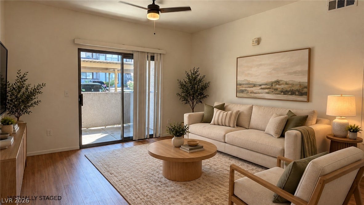 45 Maleena Mesa Street, #1912, Henderson, NV 89074 Warm hardwood flooring pairs with sliding doors that lead directly to a private balcony.