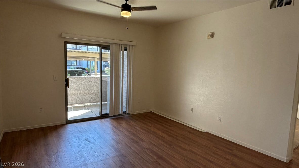 45 Maleena Mesa Street, #1912, Henderson, NV 89074 Sliding glass doors lead out to a private patio from this versatile living space.