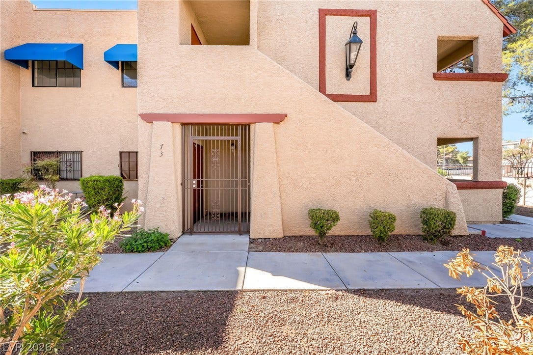 4340 Sanderling Circle, #78, Las Vegas, NV 89103 Classic southwest stucco architecture highlights a secure gated entrance and neat concrete walkways.