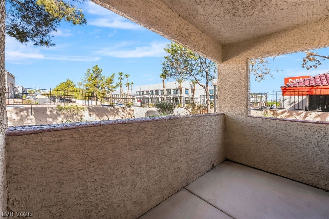 4340 Sanderling Circle, #78, Las Vegas, NV 89103 An inviting covered patio offers a quiet retreat with stucco walls and concrete flooring.