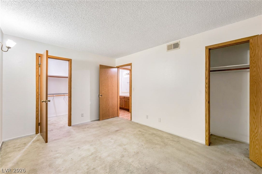 4340 Sanderling Circle, #78, Las Vegas, NV 89103 Plentiful closet space and neutral carpeting define this comfortable private bedroom suite.