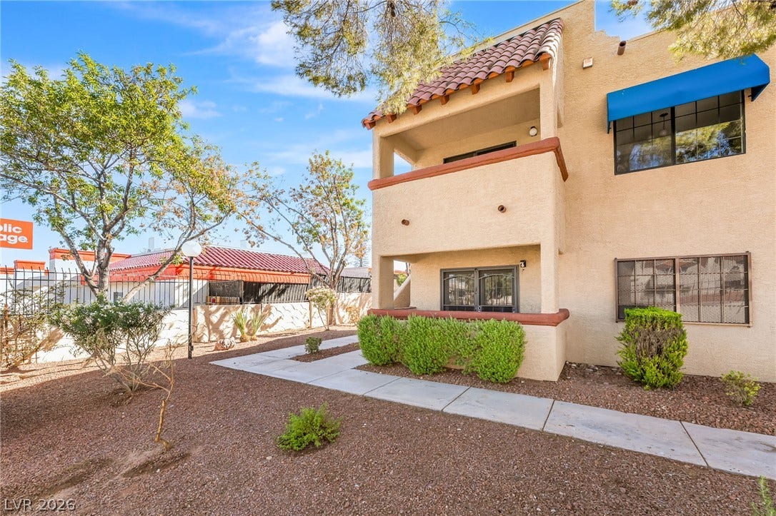 4340 Sanderling Circle, #78, Las Vegas, NV 89103 Mediterranean-inspired exterior architecture displays textured stucco walls and classic tile roof accents.