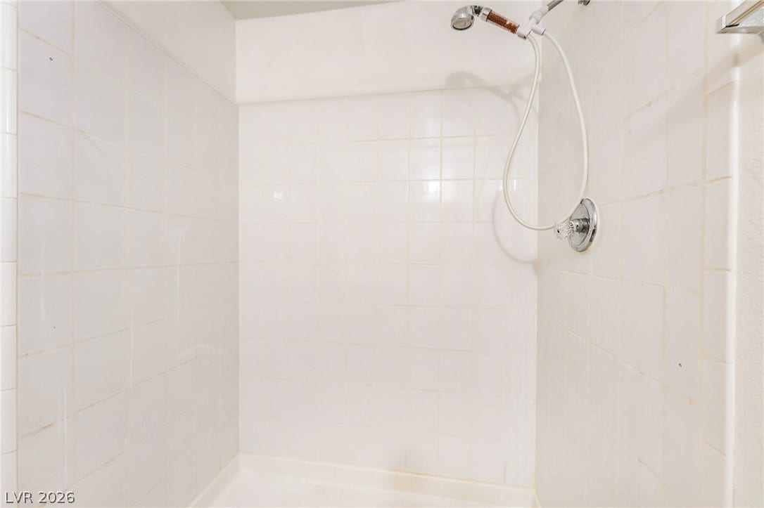 4340 Sanderling Circle, #78, Las Vegas, NV 89103 Clean tiling lines the walls of this walk-in shower enclosure.