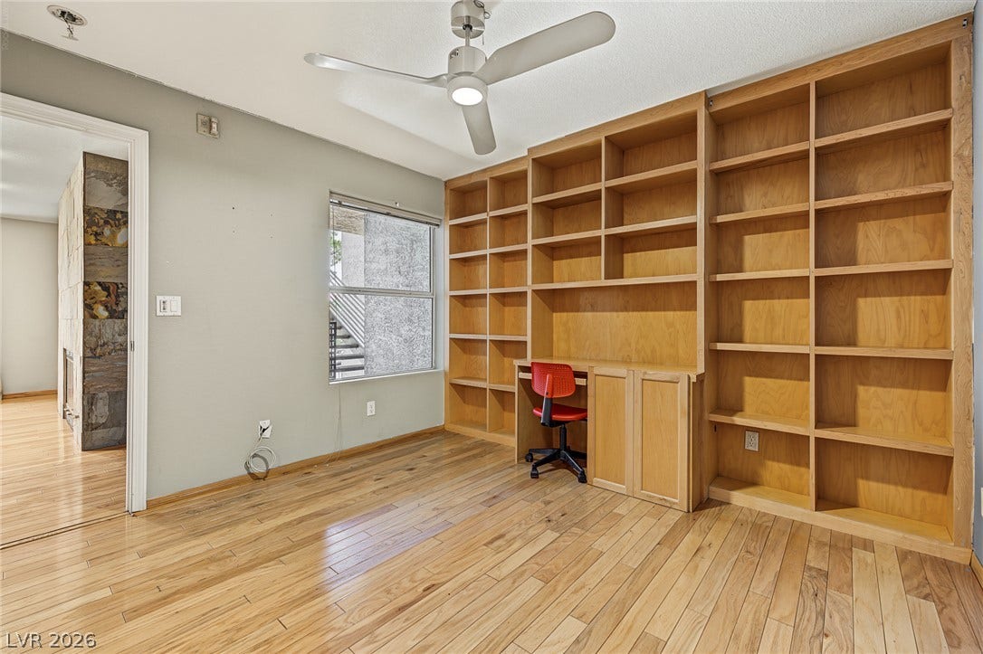 701 Capri Drive, #10B, Boulder City, NV 89005 Gleaming hardwood floors and a massive built-in wall unit define this versatile home workspace.
