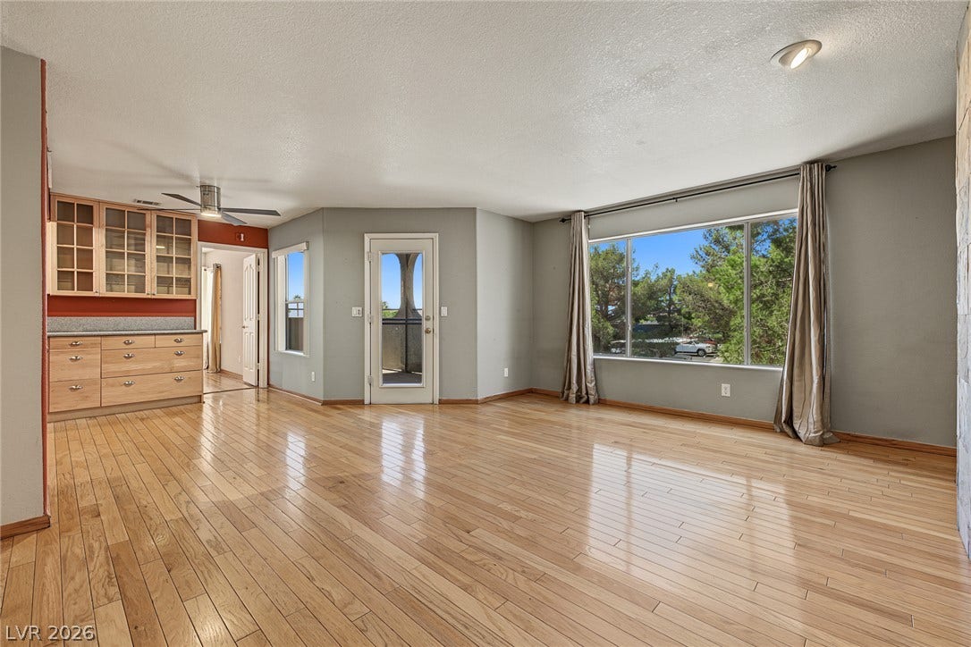701 Capri Drive, #10B, Boulder City, NV 89005 Gleaming hardwood floors and a massive picture window define this airy, open-concept living space.