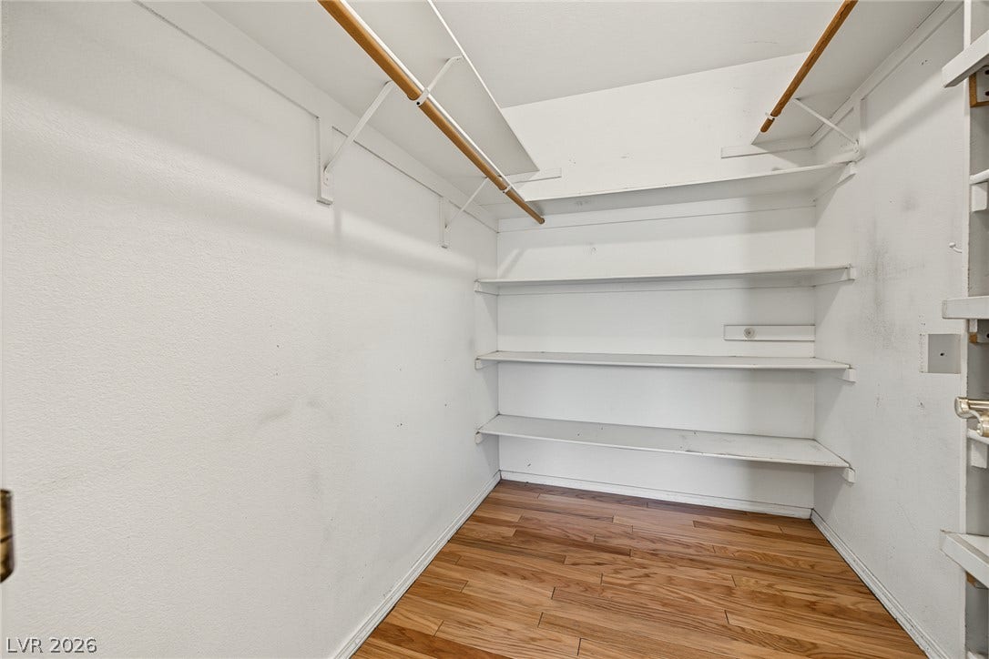701 Capri Drive, #10B, Boulder City, NV 89005 Generous storage meets classic wood flooring in this functional walk-in closet space.