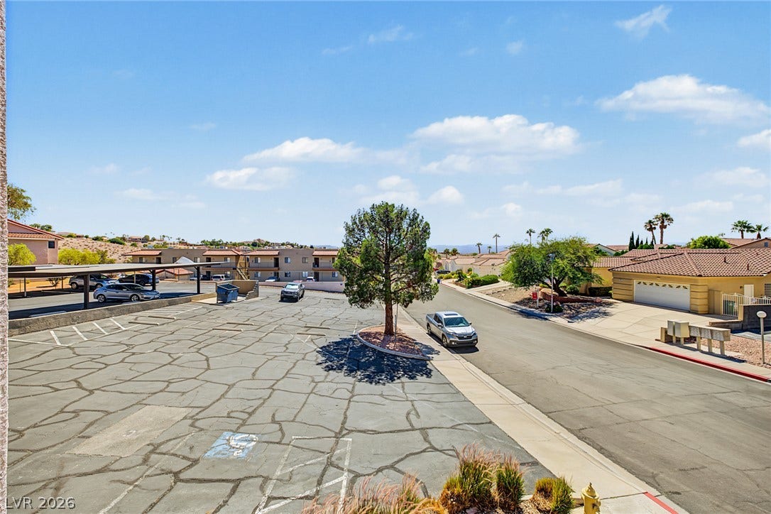 701 Capri Drive, #10B, Boulder City, NV 89005 Distant hills frame the expansive neighborhood view overlooking the community streets and parking areas.