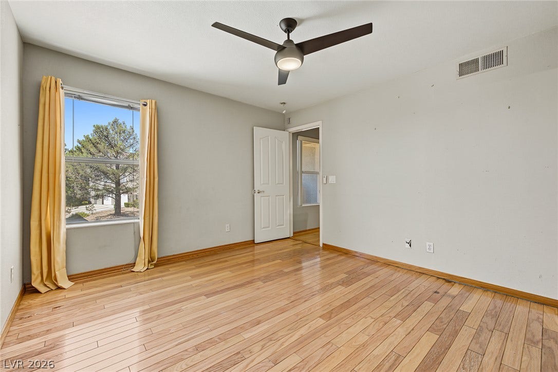 701 Capri Drive, #10B, Boulder City, NV 89005 Polished hardwood floors and a wide window frame views of the surrounding mature trees.