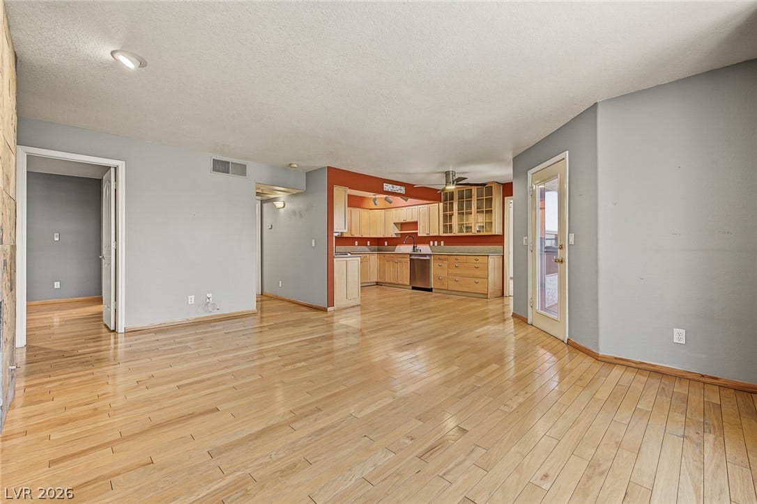 701 Capri Drive, #10B, Boulder City, NV 89005 Polished wood floors anchor this open layout flowing seamlessly toward the kitchen area.