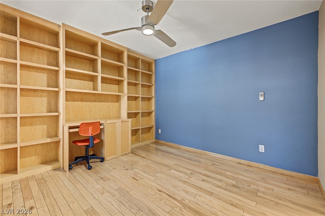 701 Capri Drive, #10B, Boulder City, NV 89005 Gleaming hardwood floors and extensive wood built-ins anchor this versatile room.