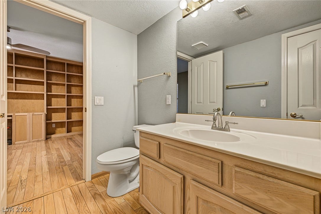 701 Capri Drive, #10B, Boulder City, NV 89005 A spacious vanity area connects directly to an adjacent walk-in closet with built-in shelving.