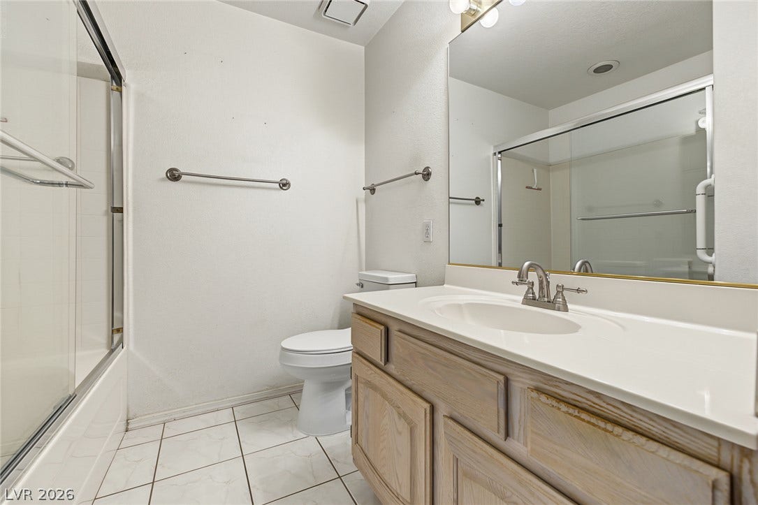 701 Capri Drive, #10B, Boulder City, NV 89005 A spacious vanity and clean tile flooring define this functional bathroom space.