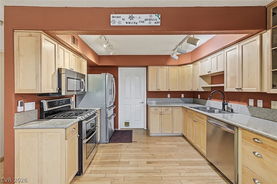 701 Capri Drive, #10B, Boulder City, NV 89005 Ample cabinetry and stone counters define this fully equipped workspace.