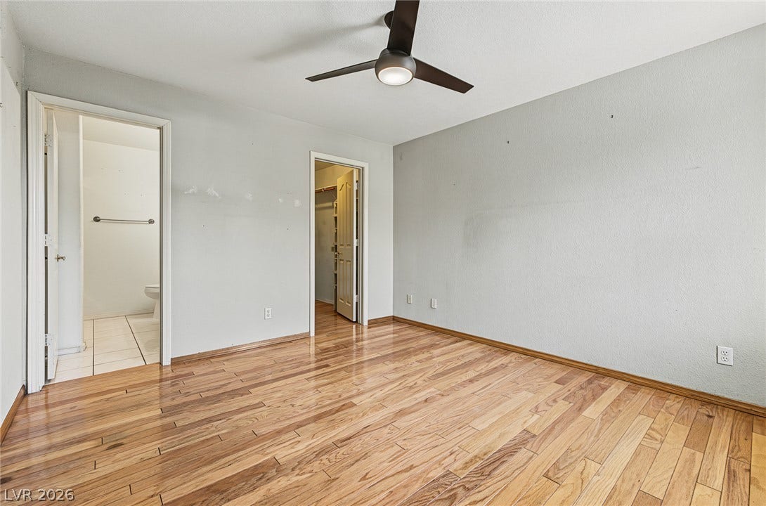 701 Capri Drive, #10B, Boulder City, NV 89005 Polished hardwood floors enrich this bedroom complete with direct closet and bathroom access.