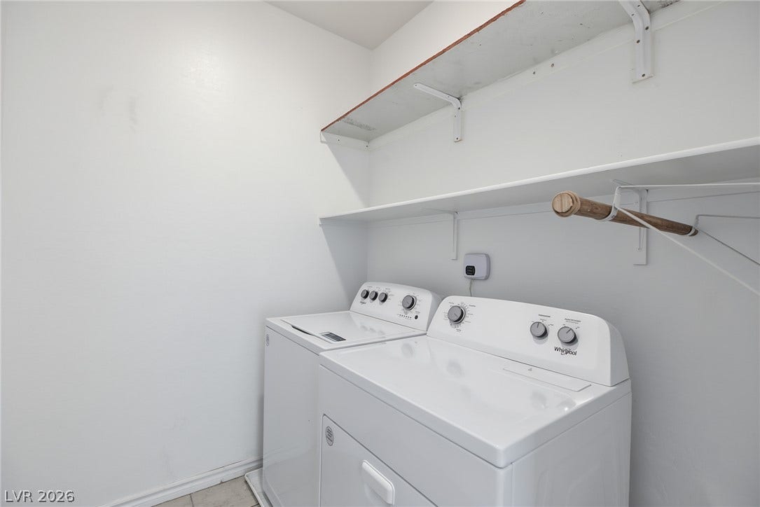 2728 Lindsey Springs Street, Las Vegas, NV 89142 Functional laundry area featuring built-in shelving and tile flooring.