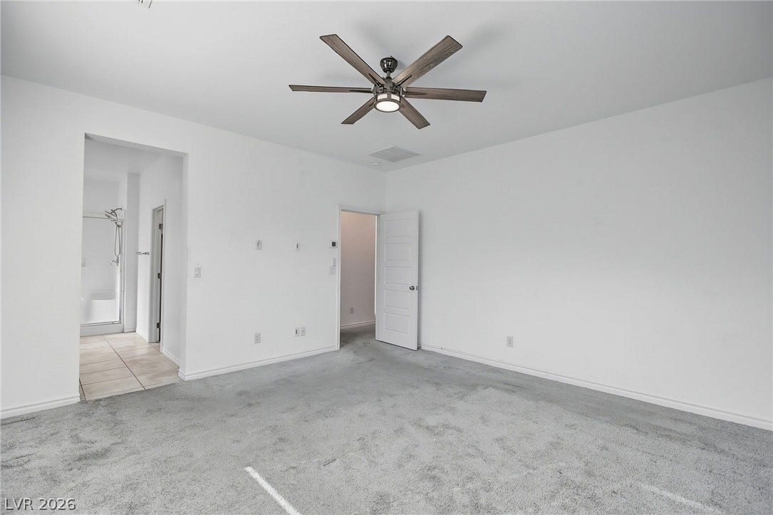 2728 Lindsey Springs Street, Las Vegas, NV 89142 An open bedroom layout connects seamlessly to an en suite bathroom with tile flooring.