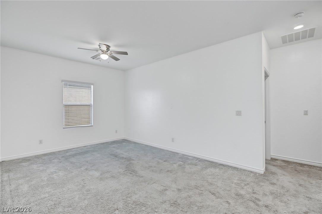 2728 Lindsey Springs Street, Las Vegas, NV 89142 Soft carpeting pairs with neutral walls in this versatile bedroom.