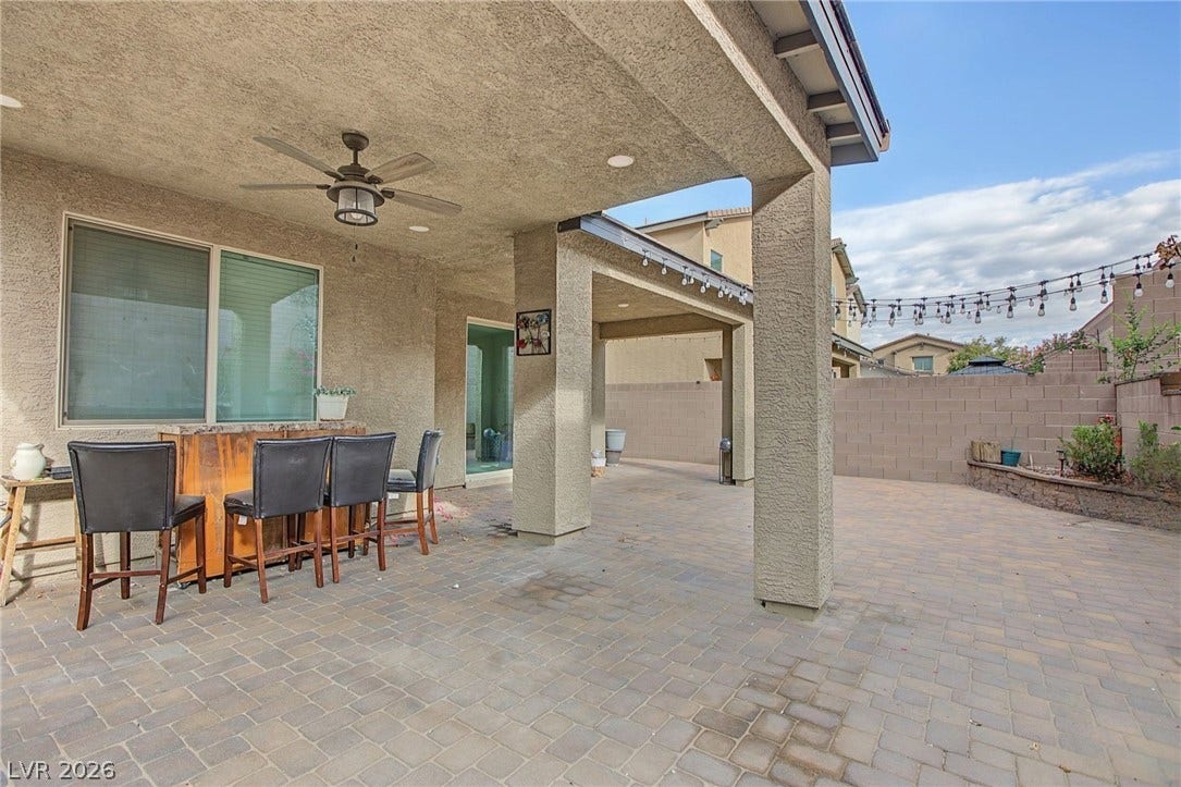 2728 Lindsey Springs Street, Las Vegas, NV 89142 A spacious covered patio features extensive pavers and structured columns in a private yard.