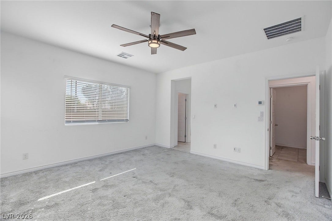 2728 Lindsey Springs Street, Las Vegas, NV 89142 Plush carpeting and natural light define this versatile bedroom space.