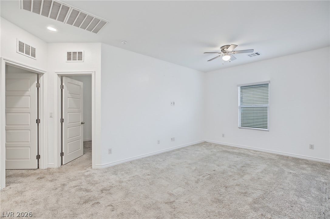2728 Lindsey Springs Street, Las Vegas, NV 89142 Plush carpeting anchors this versatile room under a tall ceiling.