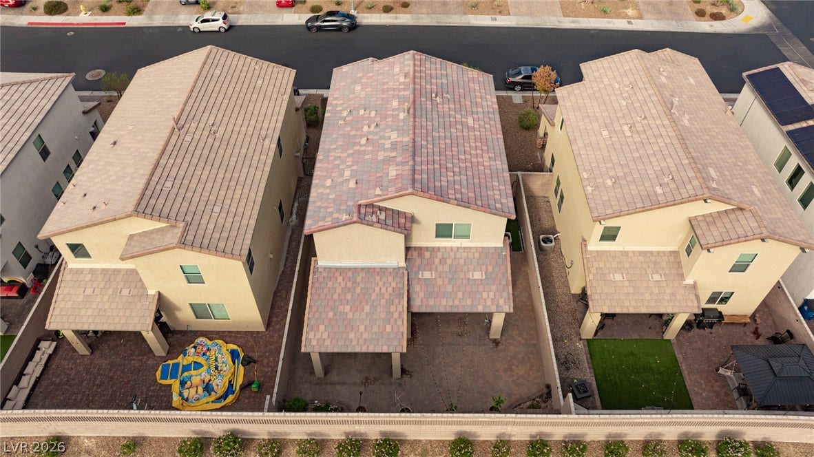 2728 Lindsey Springs Street, Las Vegas, NV 89142 An aerial perspective captures the structured layout of these modern multi-level suburban homes.