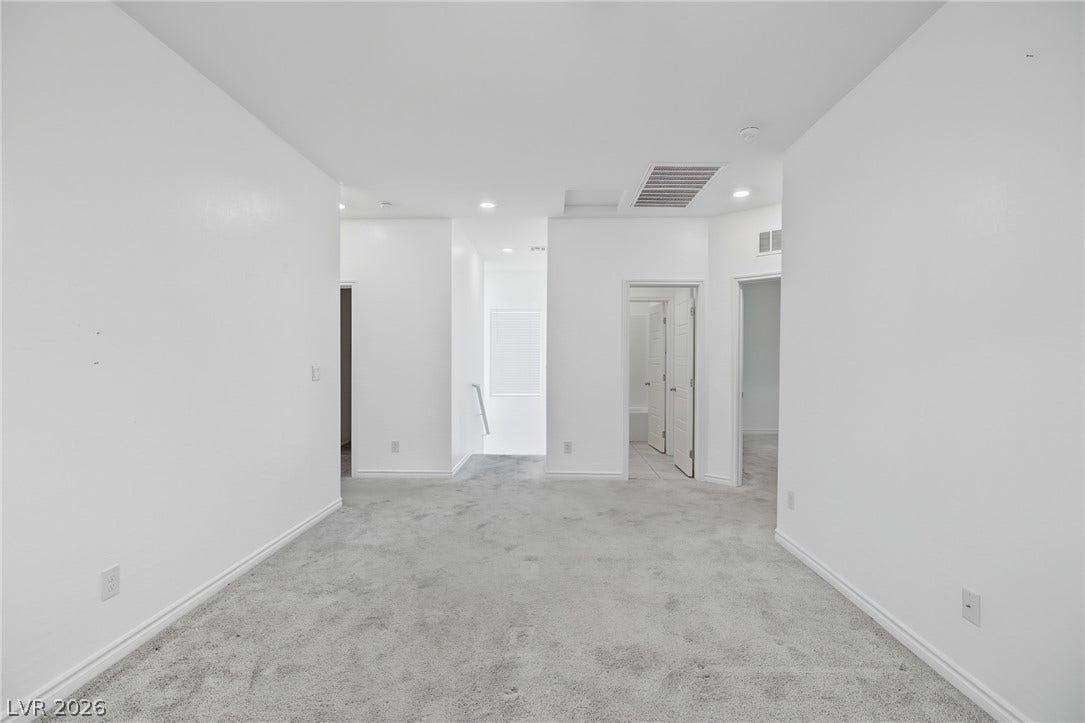 2728 Lindsey Springs Street, Las Vegas, NV 89142 Plush carpeting anchors this versatile upstairs loft area leading to multiple bedrooms.