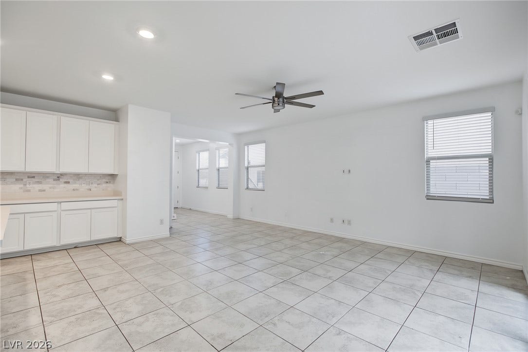 2728 Lindsey Springs Street, Las Vegas, NV 89142 An open floor plan seamlessly connects the kitchen cabinetry to a spacious living area.