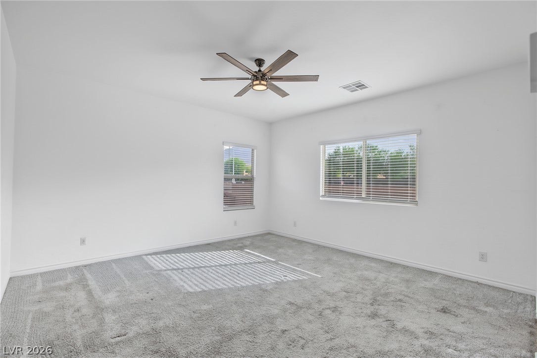 2728 Lindsey Springs Street, Las Vegas, NV 89142 Natural light streams across soft plush carpeting in this comfortable secondary bedroom.