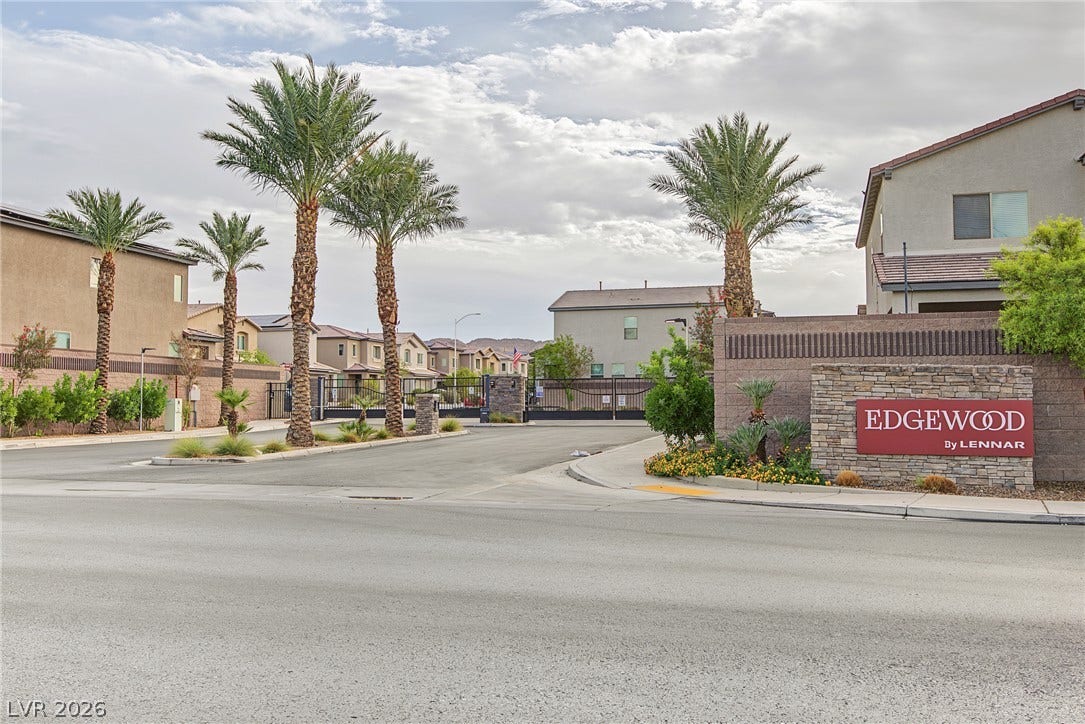 2728 Lindsey Springs Street, Las Vegas, NV 89142 Towering palm trees frame the gated stone monument entrance of this residential neighborhood.