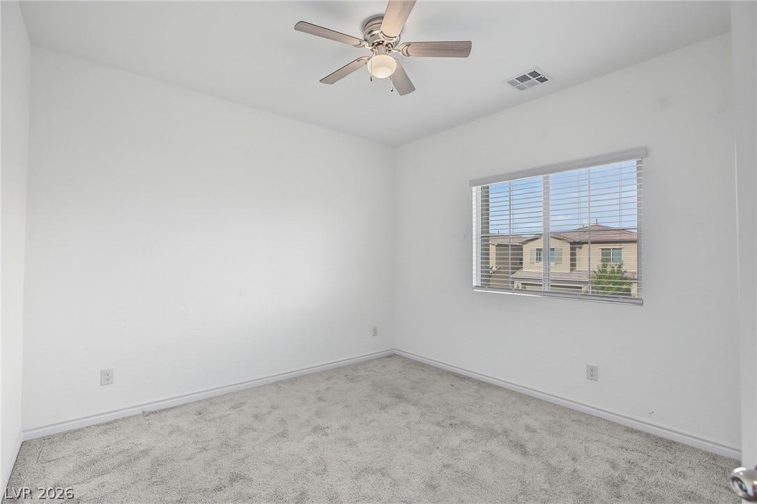 2728 Lindsey Springs Street, Las Vegas, NV 89142 Plush carpeting and natural light define this versatile room with neighborhood views.