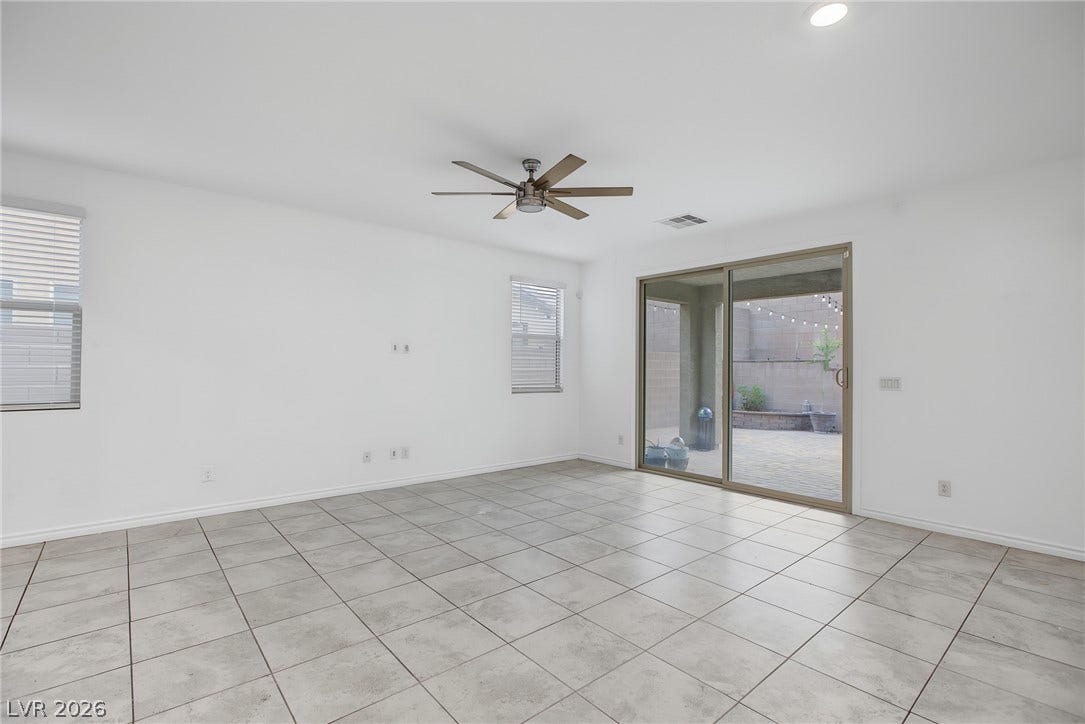2728 Lindsey Springs Street, Las Vegas, NV 89142 Tiled flooring and sliding glass doors create a seamless connection to the outdoor patio.