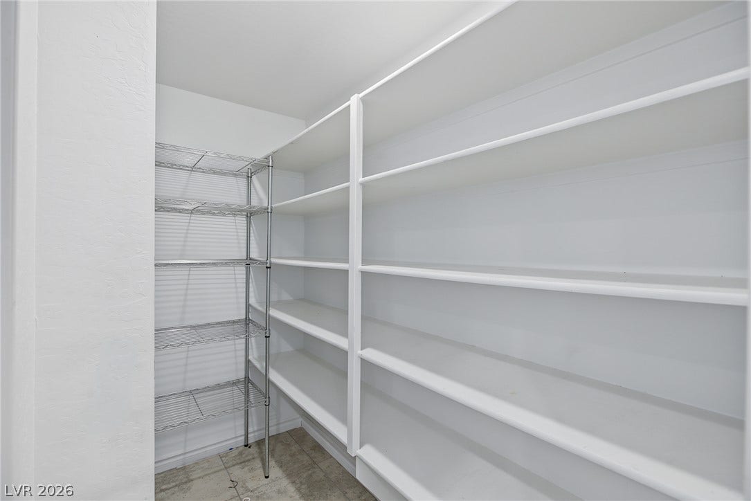 2728 Lindsey Springs Street, Las Vegas, NV 89142 Generous built-in shelving maximizes storage potential in this walk-in pantry.