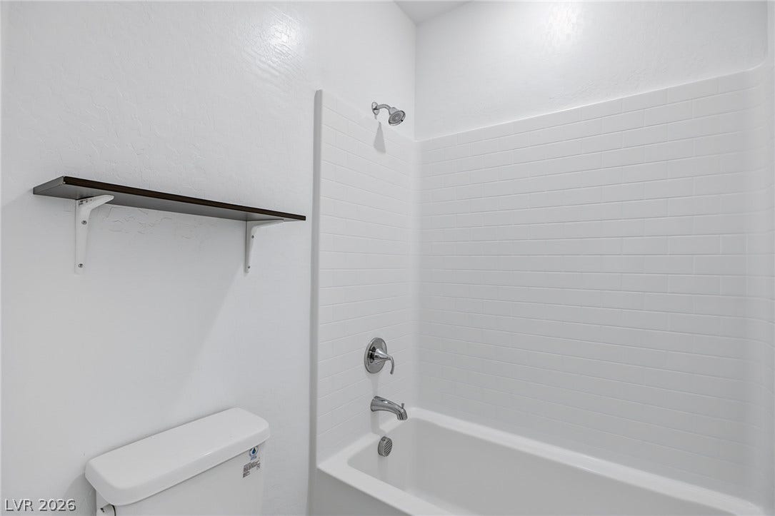 2728 Lindsey Springs Street, Las Vegas, NV 89142 Clean lines and classic subway tile surround define this welcoming bathtub area.