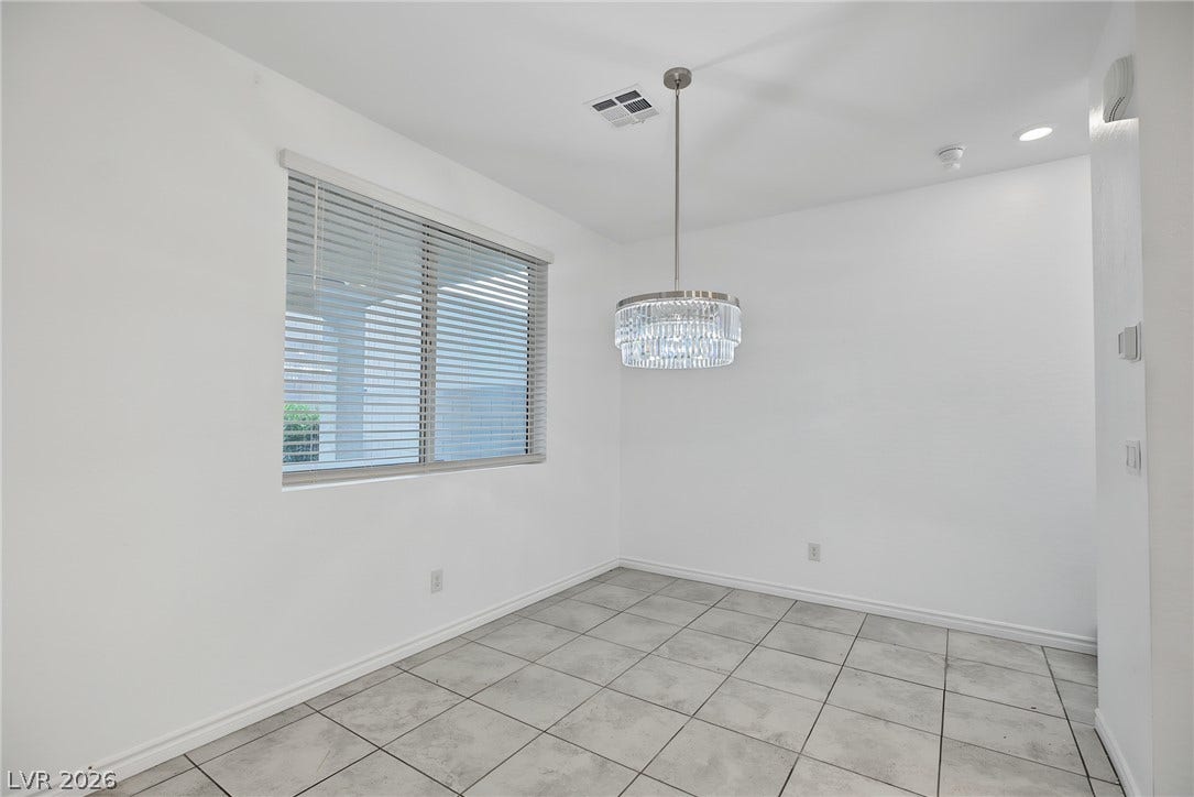 2728 Lindsey Springs Street, Las Vegas, NV 89142 A classic dining area showcases durable tile flooring alongside a large window.