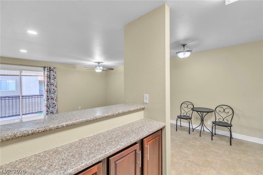 An open floorplan design connects the versatile breakfast area to adjacent living spaces.