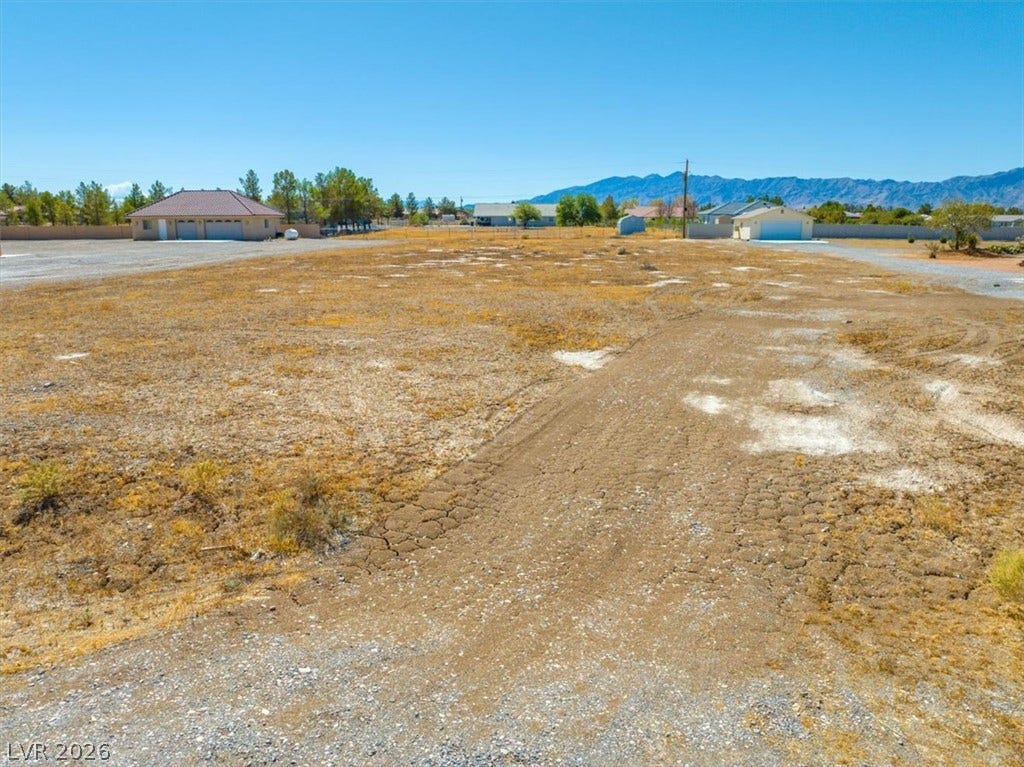 1641 W Huckleberry Street, Pahrump, NV 89048 Expansive desert acreage offers a blank canvas framed by distant mountain peaks.