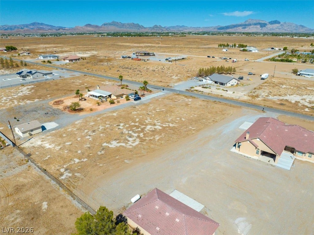 1641 W Huckleberry Street, Pahrump, NV 89048 A spacious desert lot provides panoramic mountain views and plenty of room to build.