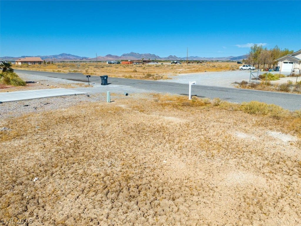 1641 W Huckleberry Street, Pahrump, NV 89048 Distant mountain ridges frame the horizon beyond this open desert parcel.