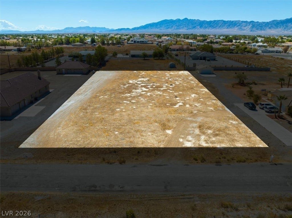 1641 W Huckleberry Street, Pahrump, NV 89048 An expansive level lot offers majestic mountain backdrops and endless building possibilities.