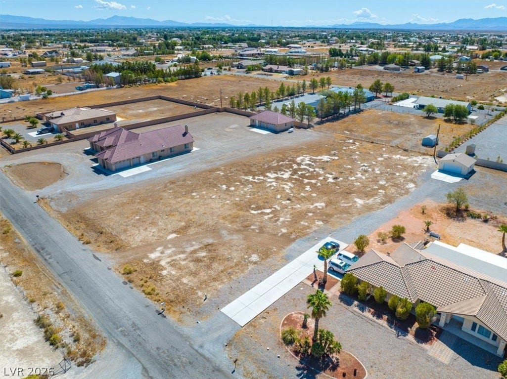 1641 W Huckleberry Street, Pahrump, NV 89048 An expansive parcel of land offers vast space surrounded by scenic mountain backdrops.