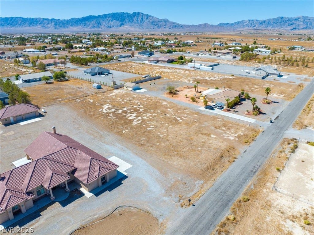 1641 W Huckleberry Street, Pahrump, NV 89048 Expansive desert lot offers endless possibilities against a backdrop of majestic mountain views.