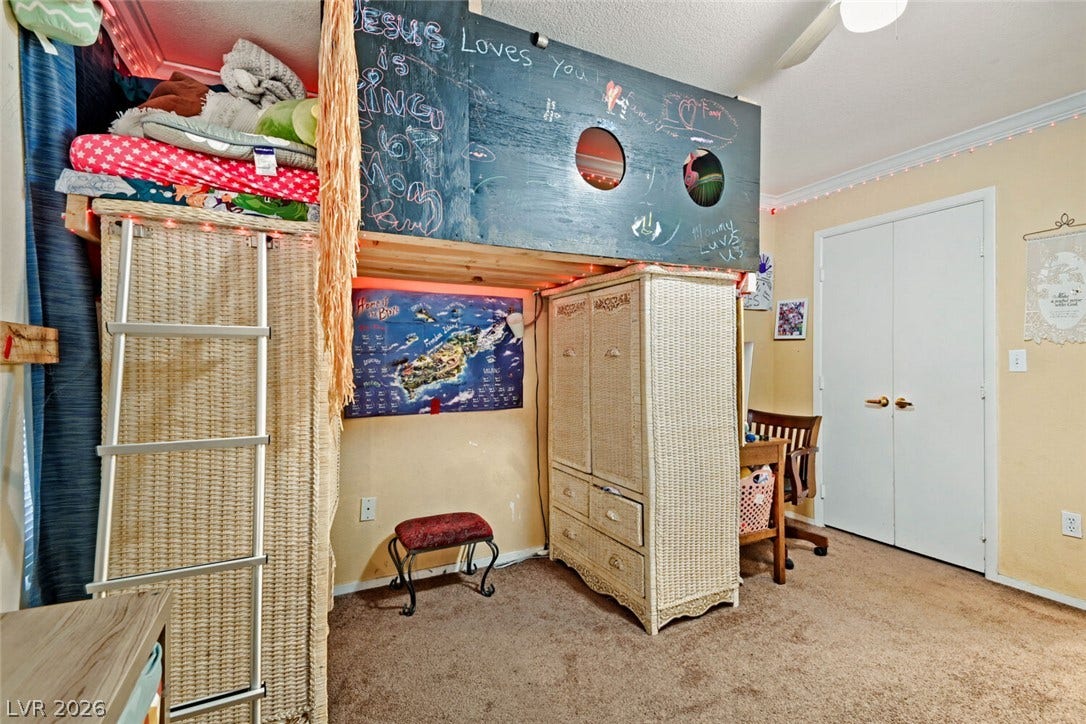 8101 W Flamingo Road, #1074, Las Vegas, NV 89147 Soft carpeting pairs with classic crown molding in this versatile secondary bedroom space.