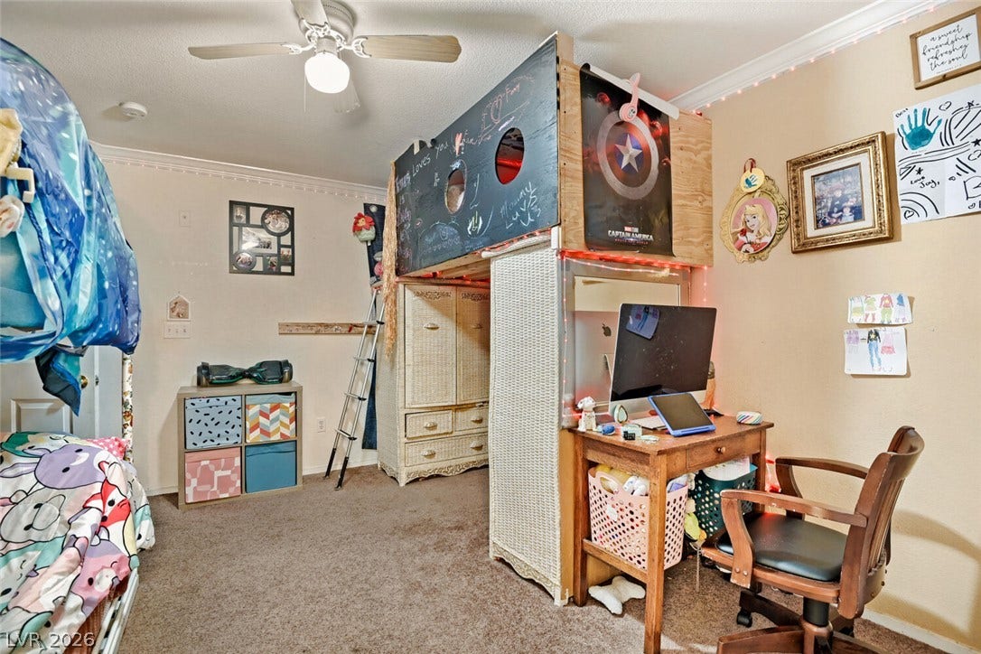 8101 W Flamingo Road, #1074, Las Vegas, NV 89147 Crown molding frames this comfortable space complete with soft carpeting.